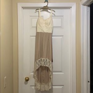 Cute high low dress with lace details and belt!